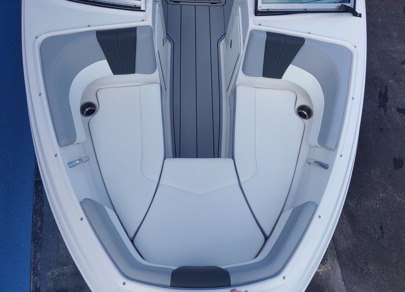 Glass fibers either loose or woven, reinforced with resin and used in the construction of many boats.