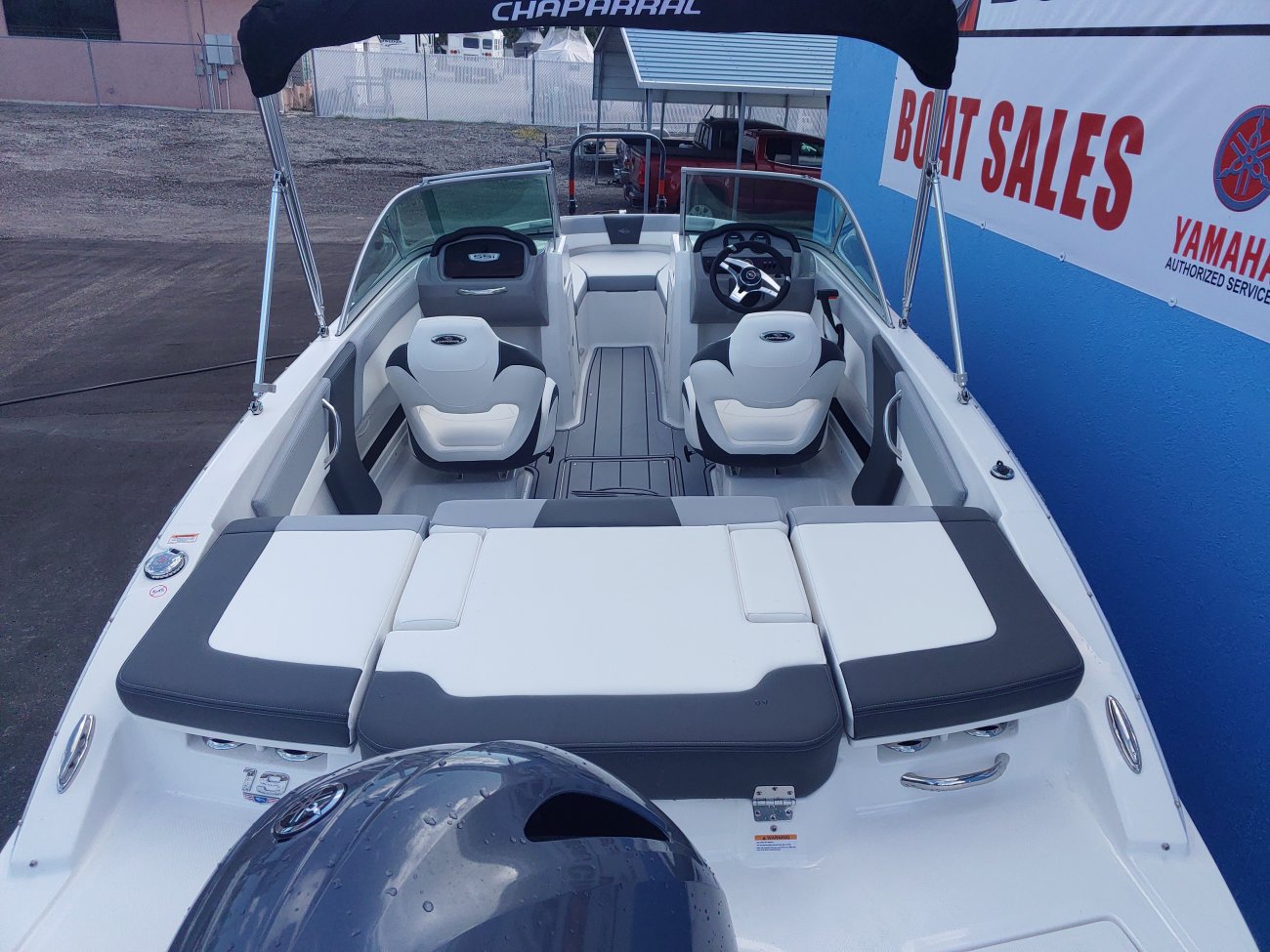 The definition of an outboard motor is a detachable engine mounted on outboard brackets on the stern of your boat.  This configuration will have only one single engine.