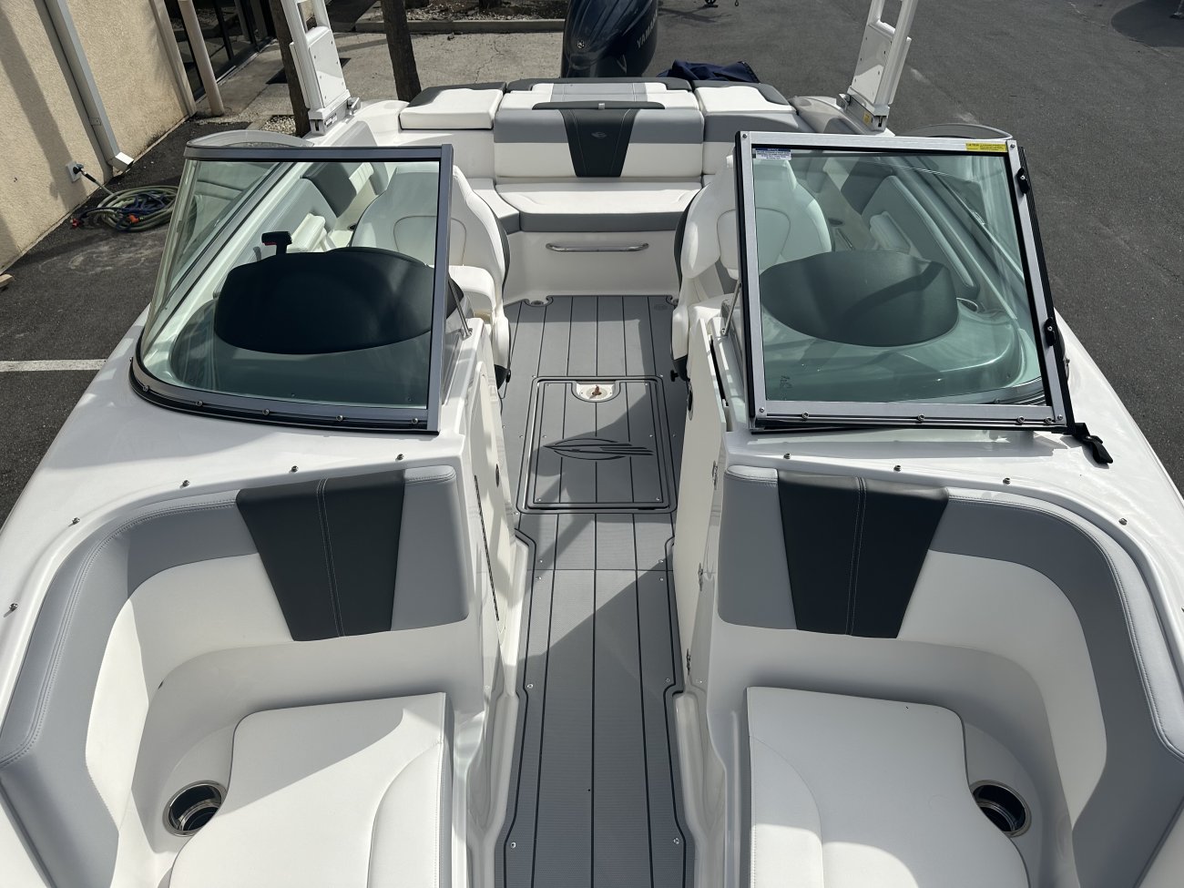 Glass fibers either loose or woven, reinforced with resin and used in the construction of many boats.