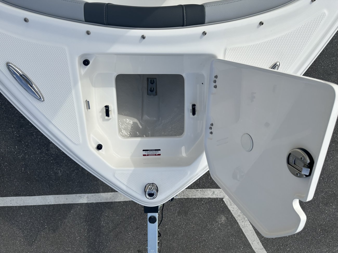 A dual console boat is typically one that was designed for salt water fishing and has the console split around a center walk thru to the bow.  The helm is usually starboard while there is passenger seating to port.
