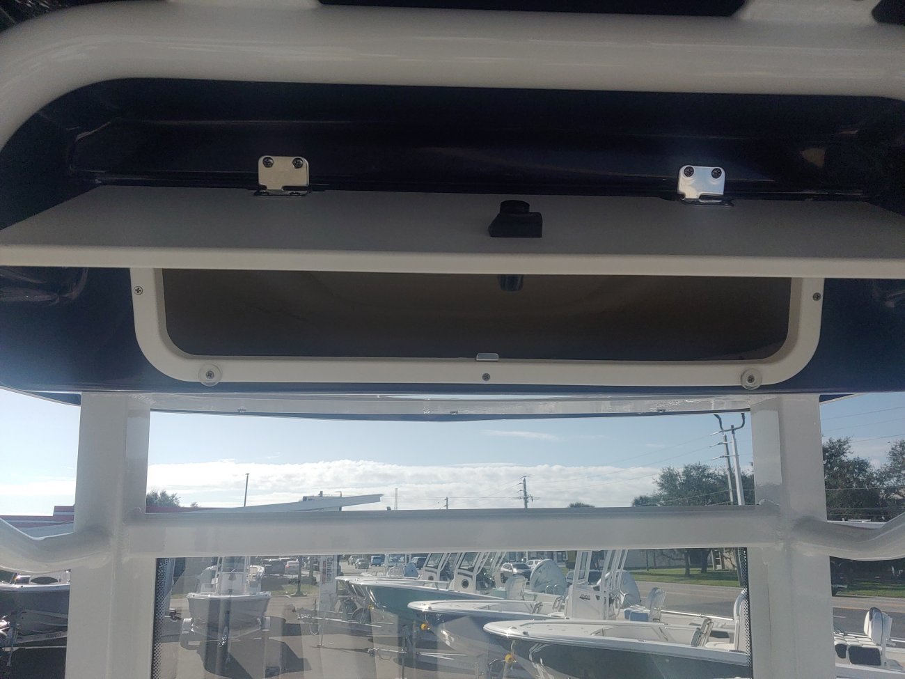 The definition of an outboard motor is a detachable engine mounted on outboard brackets on the stern of your boat.  This configuration will have only one single engine.