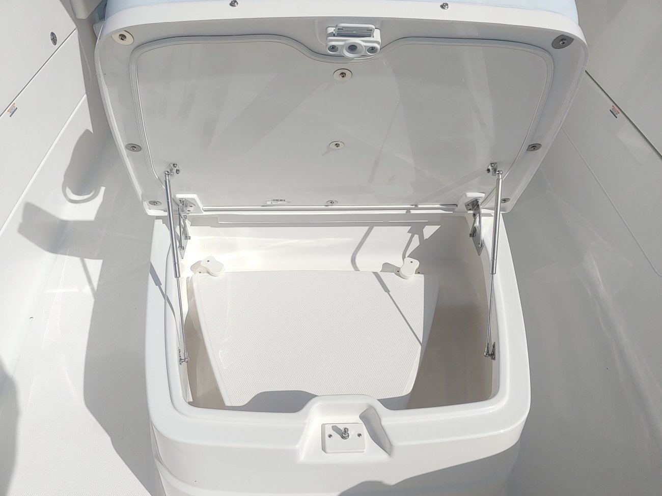 Glass fibers either loose or woven, reinforced with resin and used in the construction of many boats.