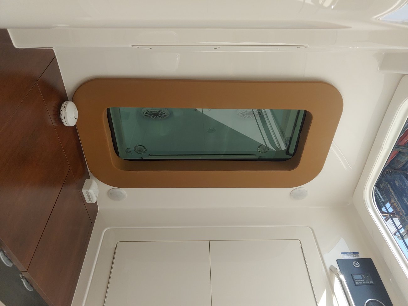 Glass fibers either loose or woven, reinforced with resin and used in the construction of many boats.