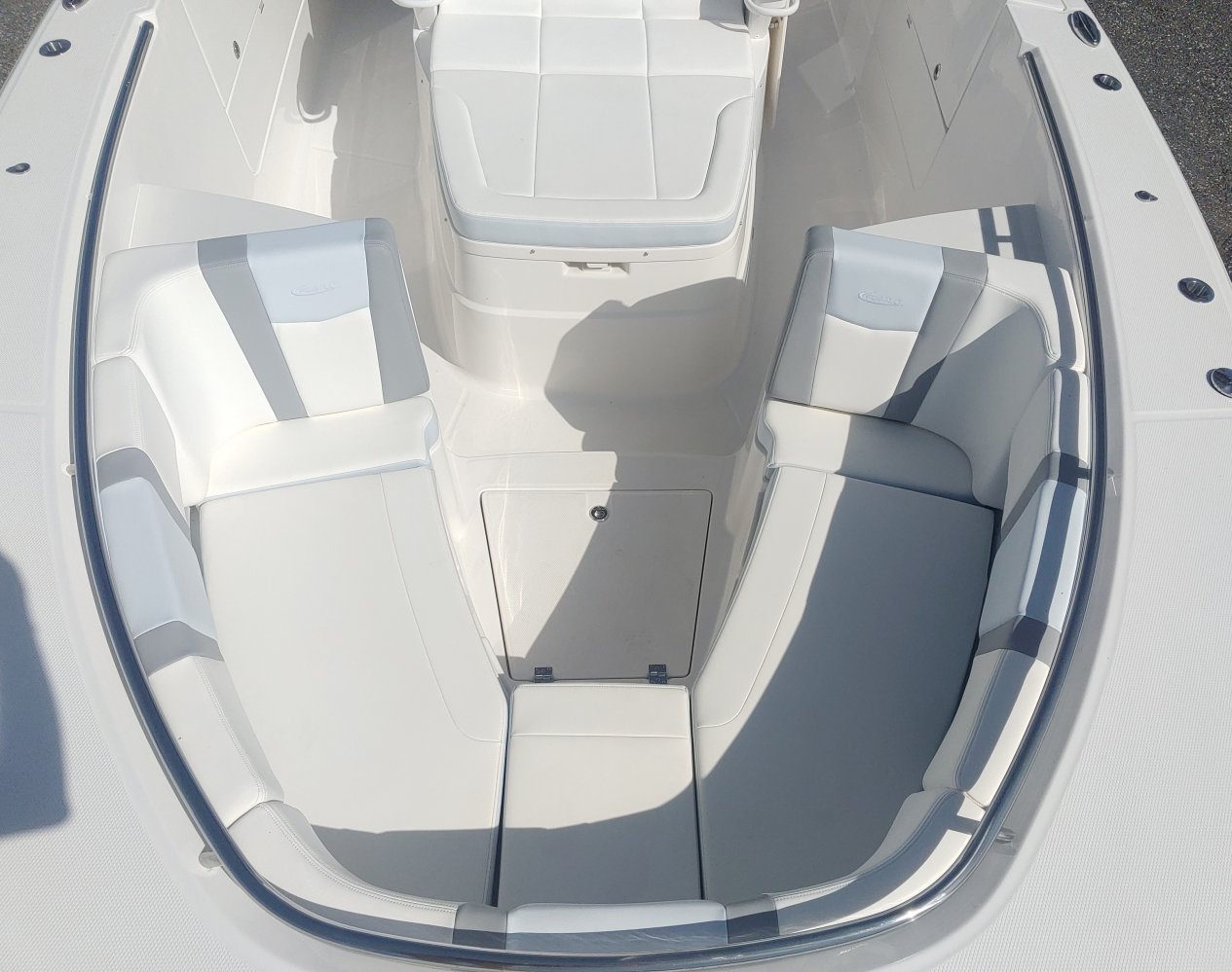 Center console is an open hull boat where the console of the boat is in the center. The boat deck surrounds the console so that a person can walk all around the boat from stern to bow with ease. Most center consoles are powered by outboard motors.