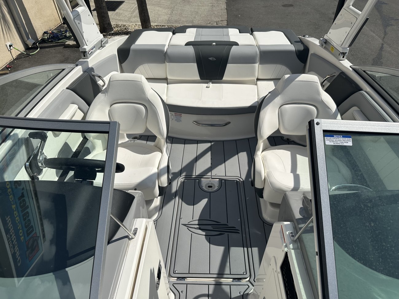 Glass fibers either loose or woven, reinforced with resin and used in the construction of many boats.