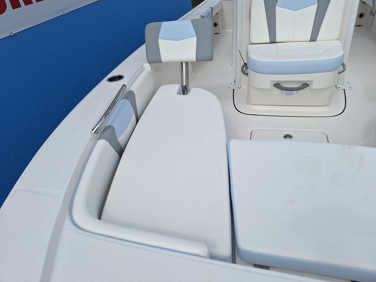 Glass fibers either loose or woven, reinforced with resin and used in the construction of many boats.
