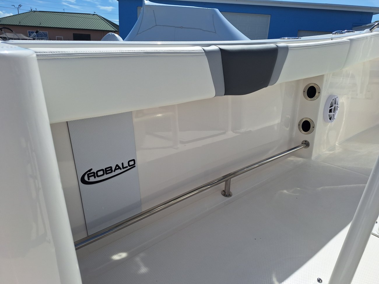 The definition of an outboard motor is a detachable engine mounted on outboard brackets on the stern of your boat.  This configuration will have only one single engine.