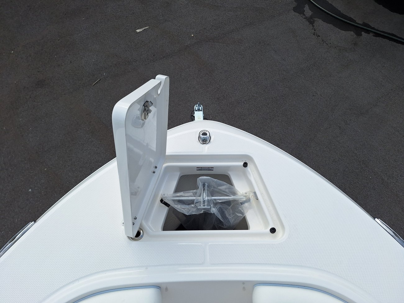 Glass fibers either loose or woven, reinforced with resin and used in the construction of many boats.