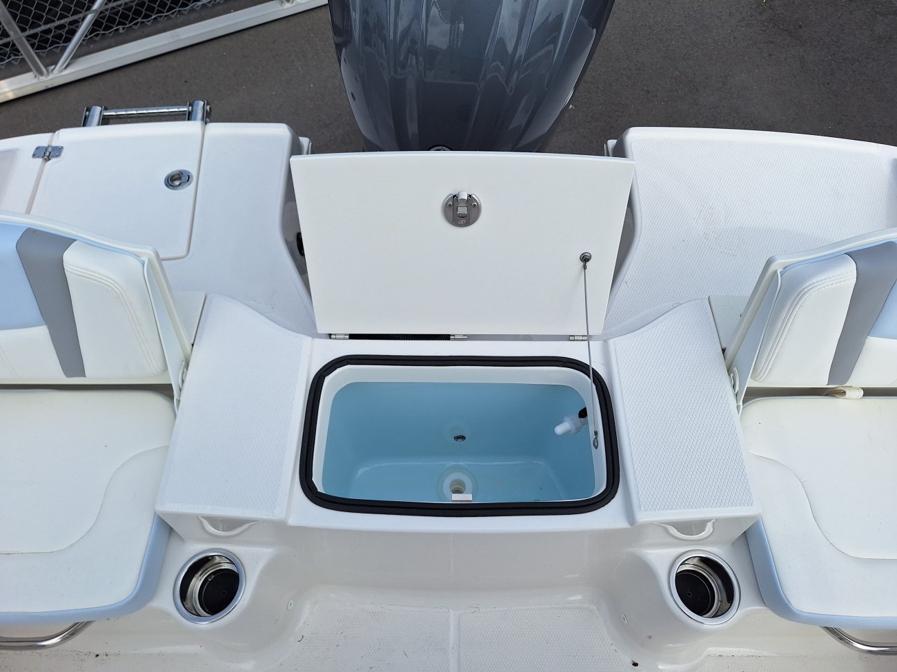 The definition of an outboard motor is a detachable engine mounted on outboard brackets on the stern of your boat.  This configuration will have only one single engine.