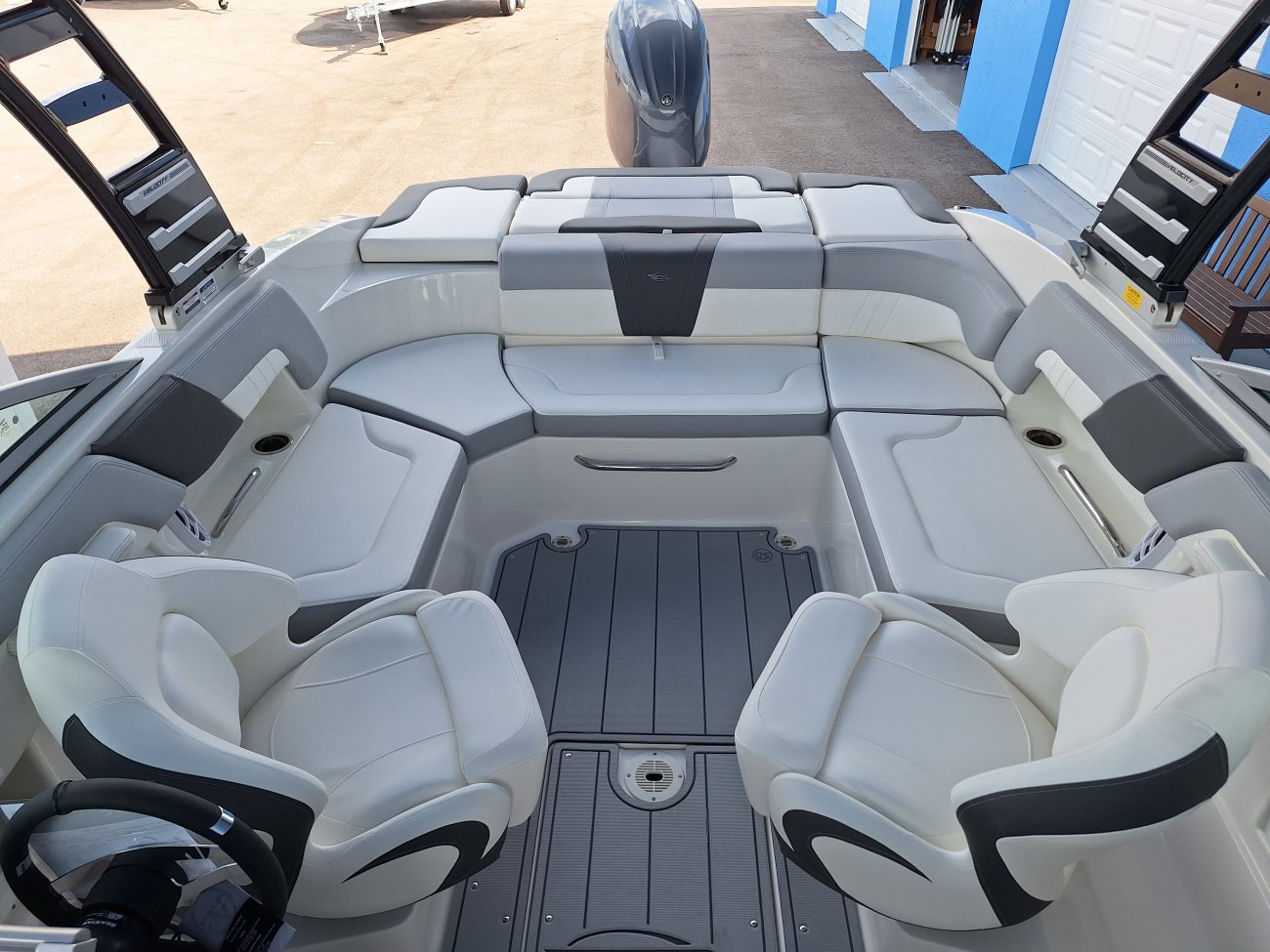 The definition of an outboard motor is a detachable engine mounted on outboard brackets on the stern of your boat.  This configuration will have only one single engine.