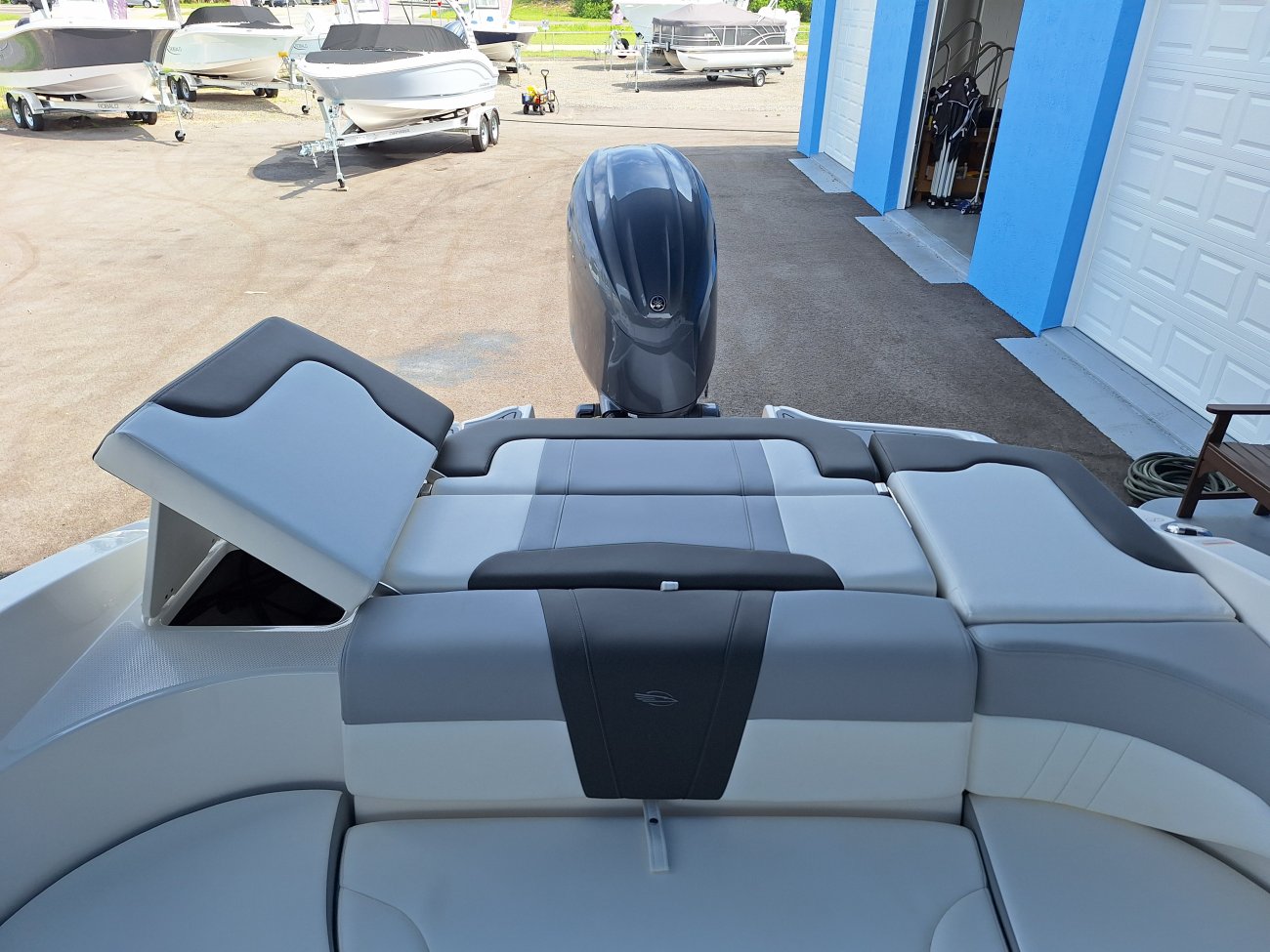 The definition of an outboard motor is a detachable engine mounted on outboard brackets on the stern of your boat.  This configuration will have only one single engine.