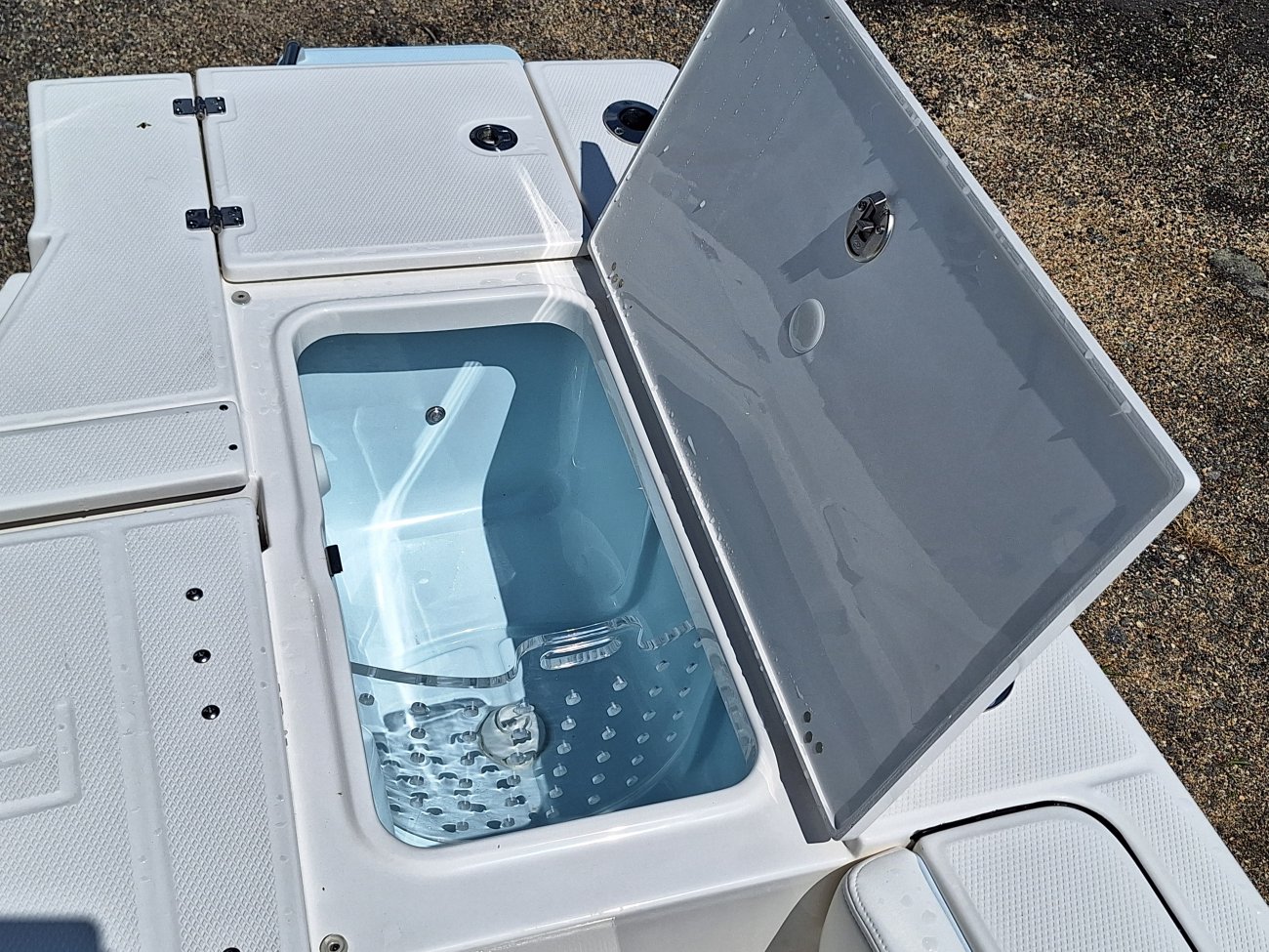 Center console is an open hull boat where the console of the boat is in the center. The boat deck surrounds the console so that a person can walk all around the boat from stern to bow with ease. Most center consoles are powered by outboard motors.